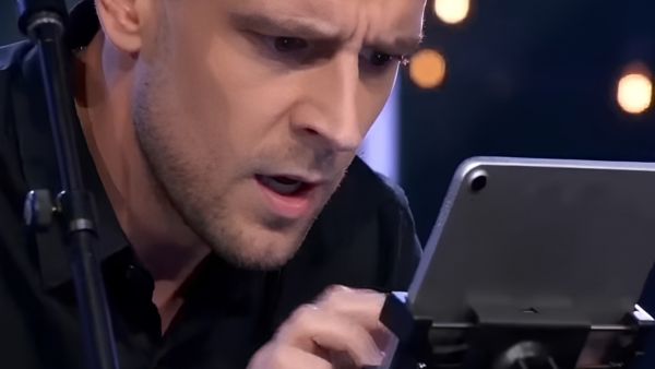singer staring into ipad