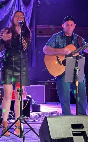 Musicians using tablets and iphones